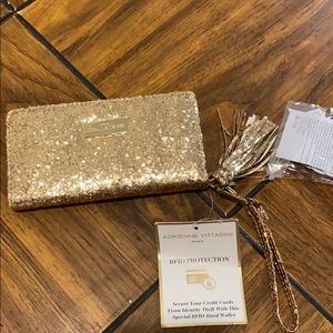 Adrienne Vittadini wallet that charges phone